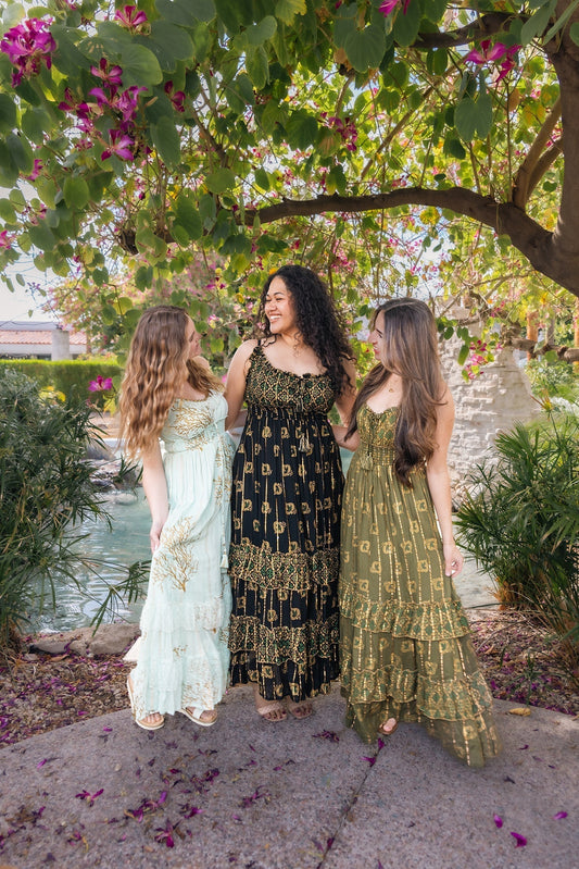 3 women in boho inspired dresses